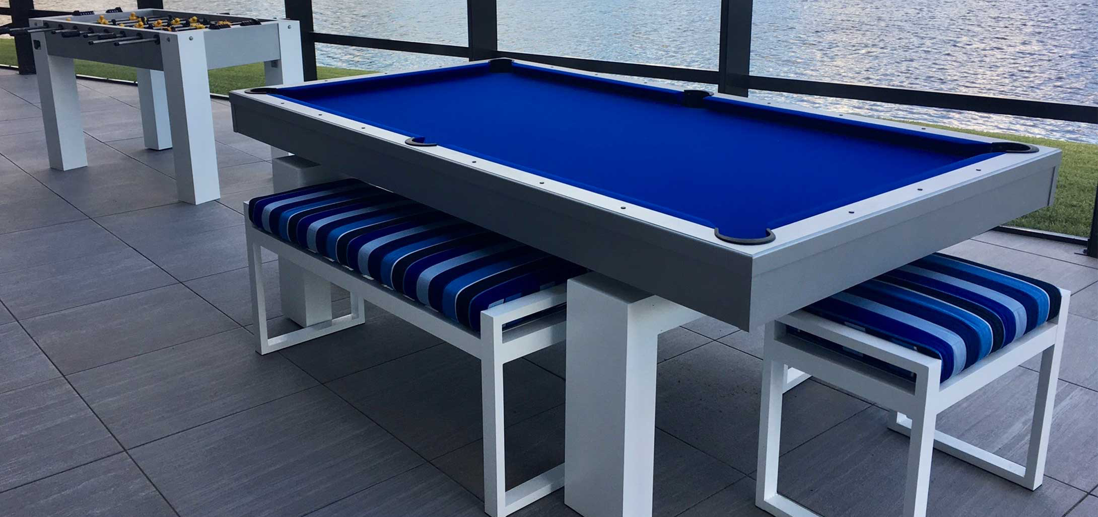 Outdoor Pool Table and Foosball Table on a deck at a lake